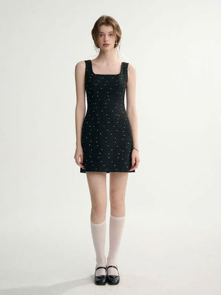 Ardor Tweed Mini Dress in Black with classic tweed fabric, perfect for a chic and sophisticated look.