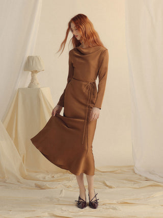 Model styled in the Glow Boat Neck Long Dress Brown, showcasing its timeless elegance – Sincethen